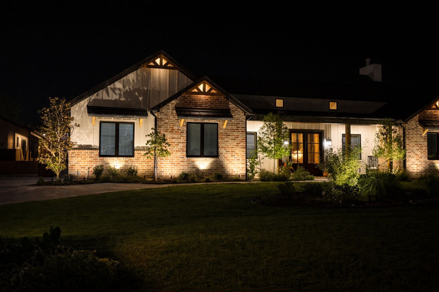 Front entryway with elegant landscape lighting design for Dallas curb appeal