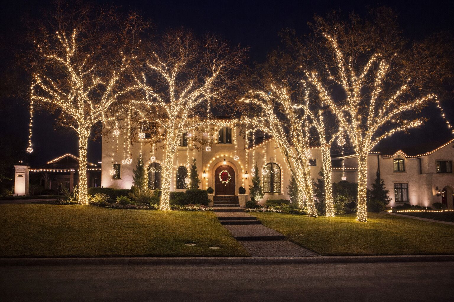 Complete outdoor lighting package transforming luxury home curb appeal after dark