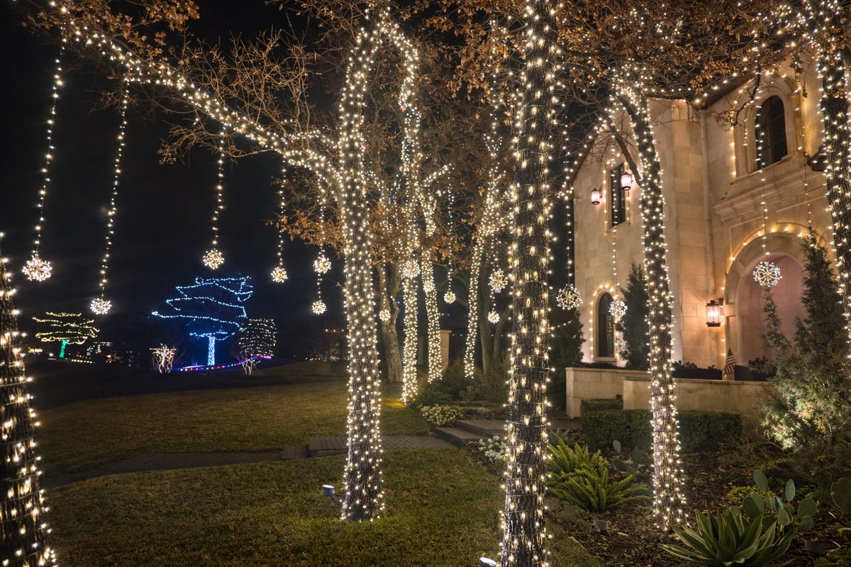 Roofline and landscape holiday lighting on a high-end residential property