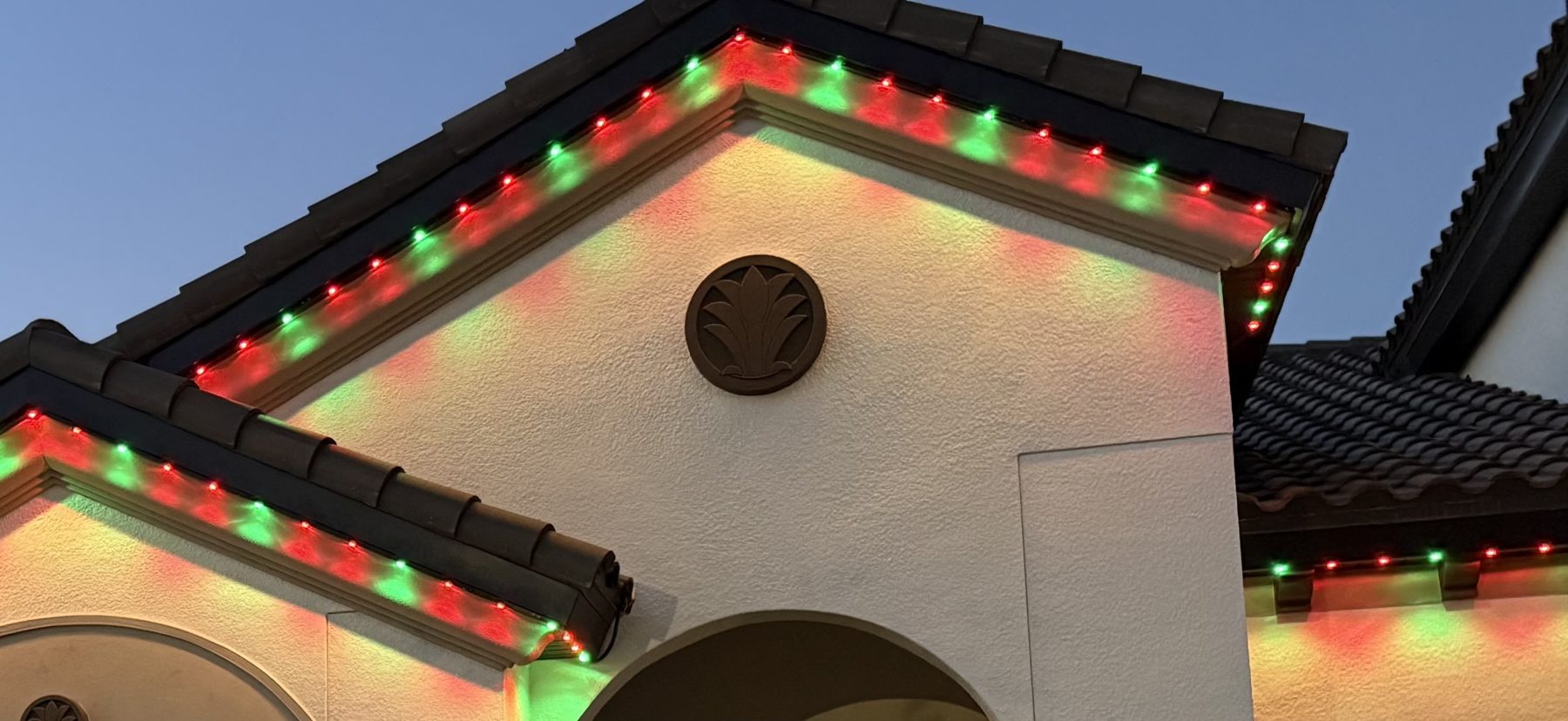 Permanent lighting in red and green on a gable