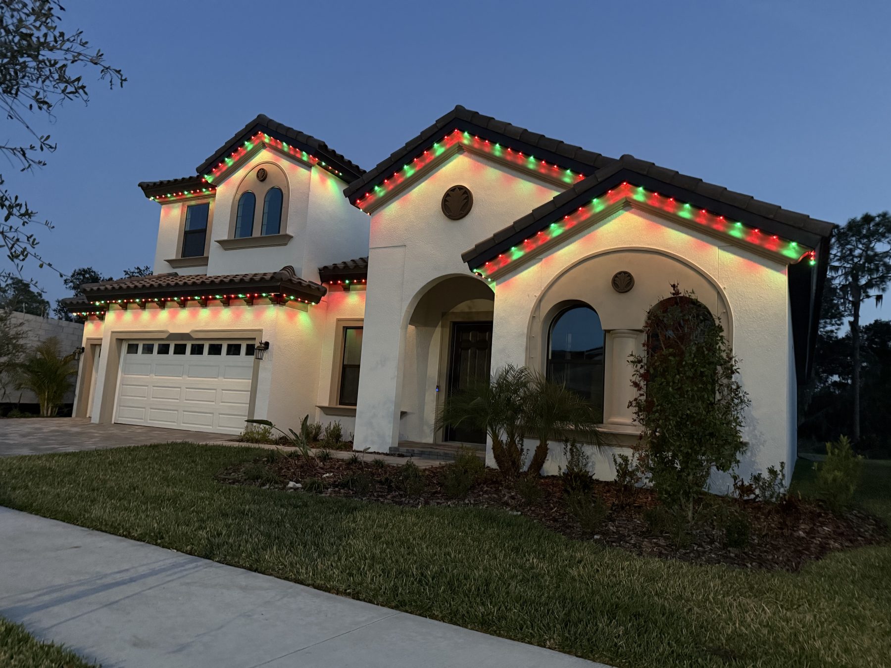 Permanent lighting along the eave of a single garage