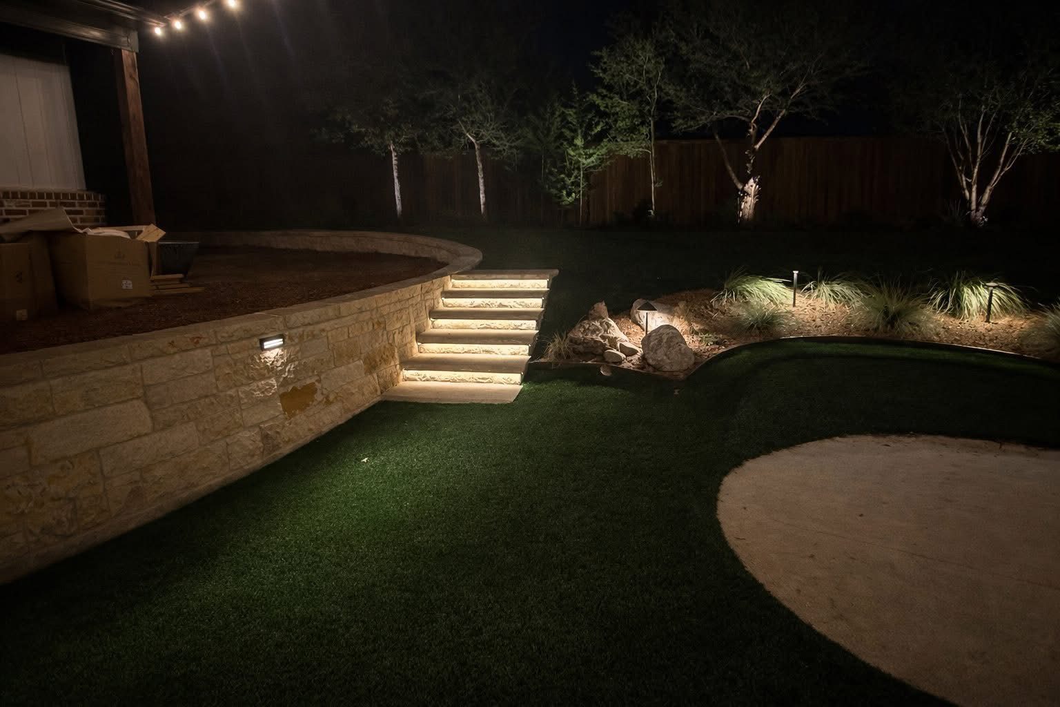Strip lighting in the treads of curved stone steps