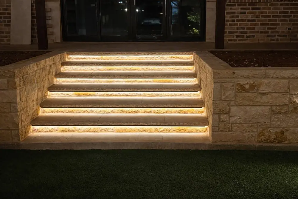 Strip lighting in the risers of stone steps